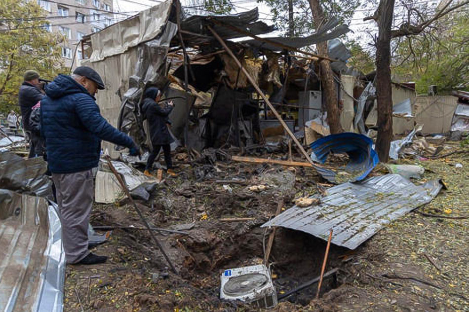 A local resident inspects a crater next to a destroyed kiosk following a drone attack in Odesa on Novemner 10, 2024, amid the Russian invasion in Ukraine. Oleksandr Gimanov, AFP