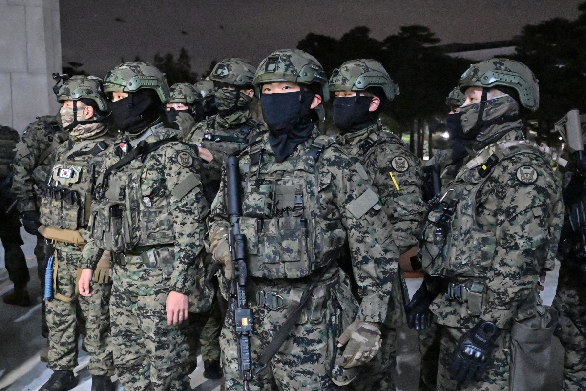 Soldiers try to enter the National Assembly building in Seoul on December 4 2024, after South Korea President Yoon Suk Yeol declared martial law. Jung Yeon-je, AFP