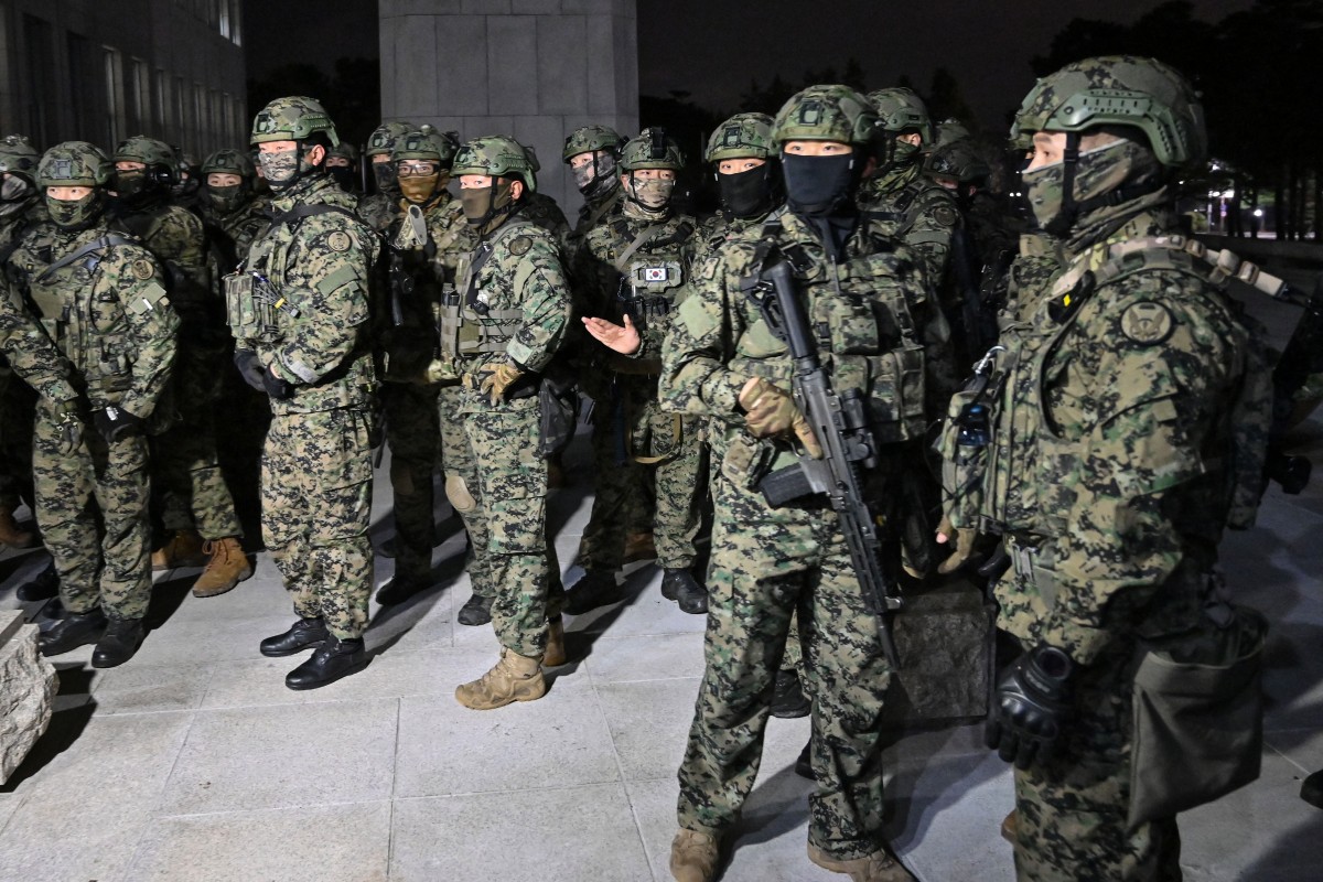 Soldiers try to enter the National Assembly building in Seoul on December 4 2024, after South Korea President Yoon Suk Yeol declared martial law. Jung Yeon-je, AFP