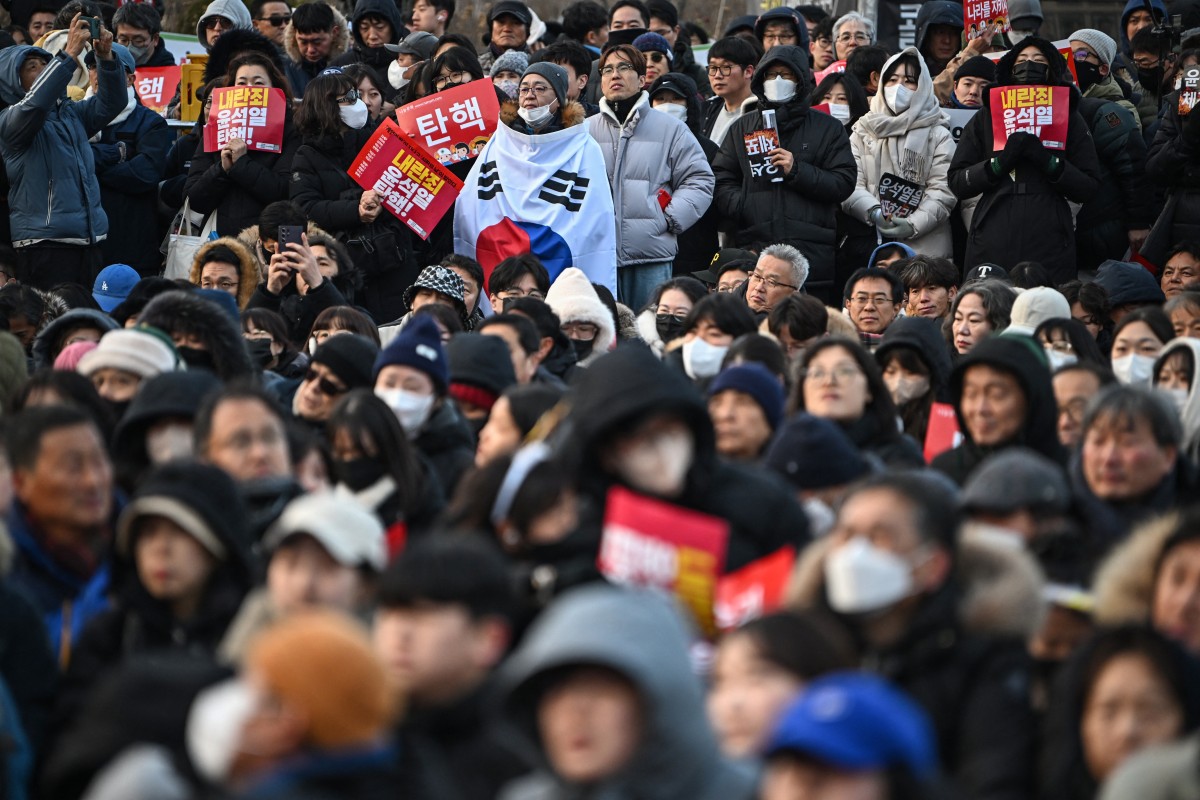 People take part in a protest calling for the ouster of South Korean President Yoon Suk Yeol outside the National Assembly in Seoul on December 7, 2024. Philip Fong, AFP