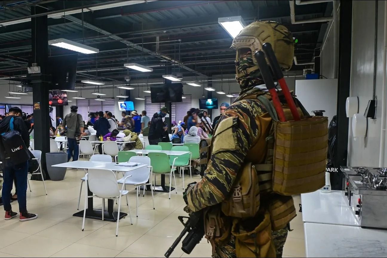 Government security forces raid a BPO compound in Bagac, Bataan on October 31,2024 alleged to be an illegal Philippine offshore gaming operator (POGO), following a search warrant for human trafficking violations. Maria Tan, ABS-CBN News/file