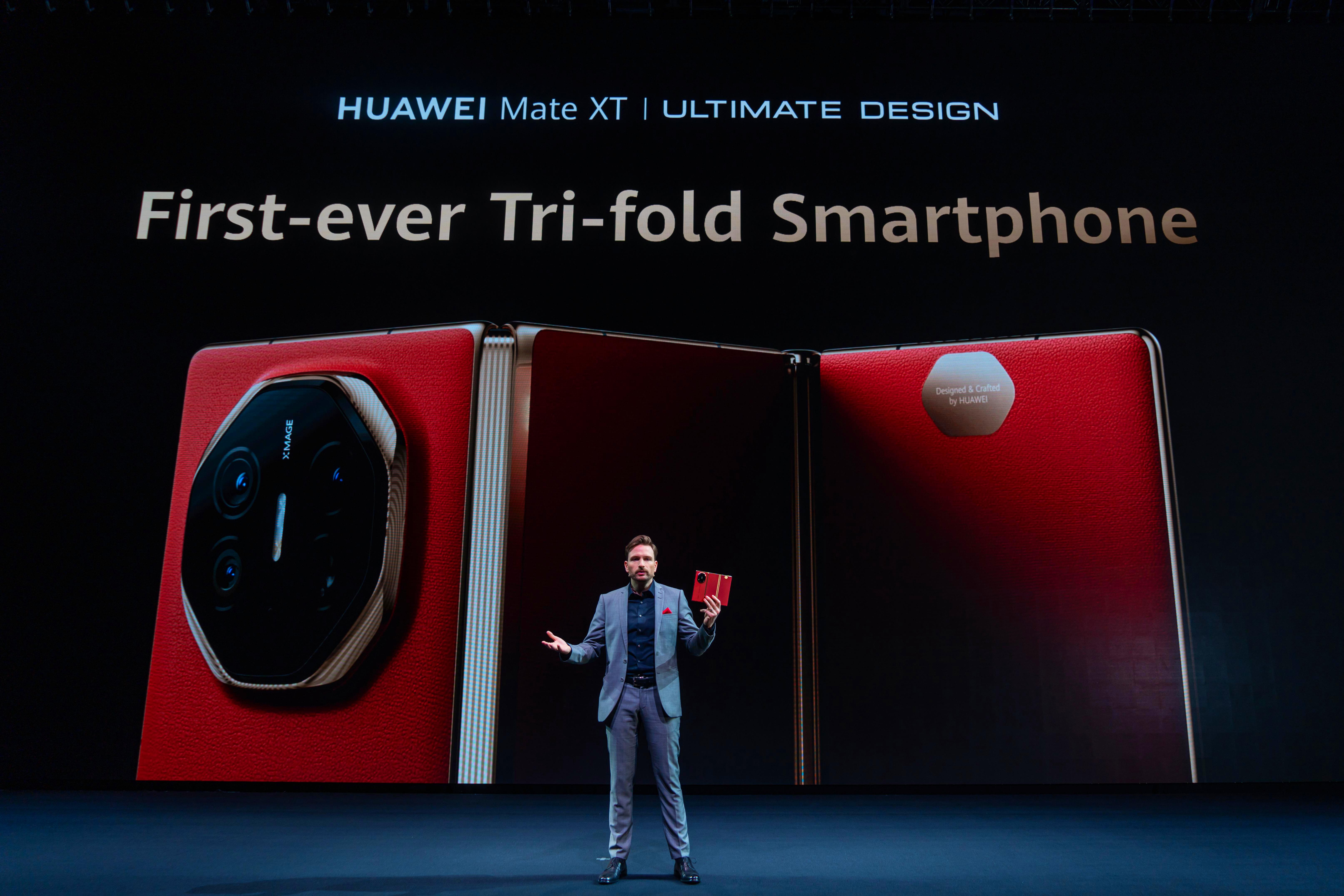 Huawei Head of Product Andreas Zimmer presents the 'tri-fold' Huawei Mate XT Ultimate Design at the company's global launch event in Kuala Lumpur, Malaysia on Feb. 18, 2025. Handout